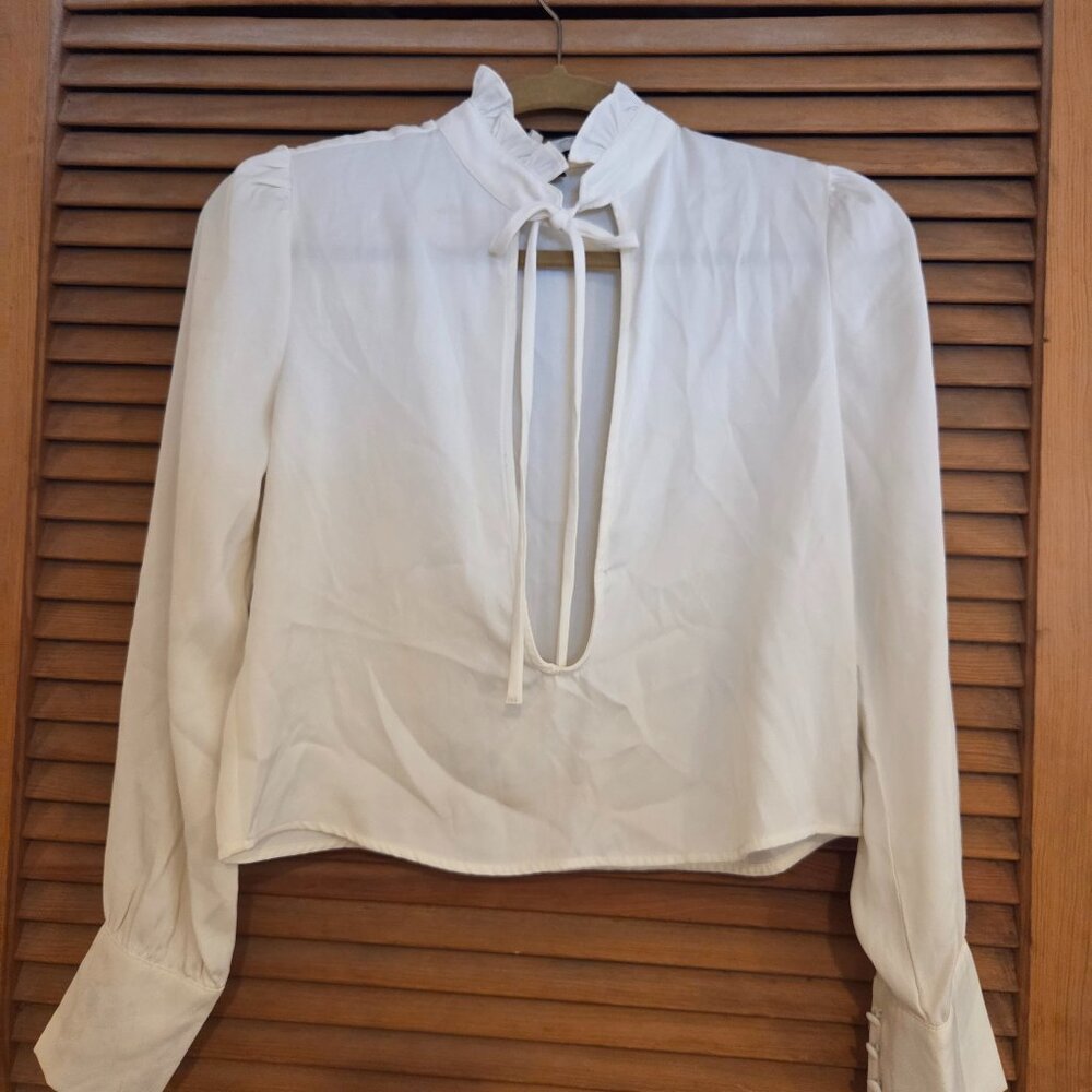 blouse with ruffled neckline